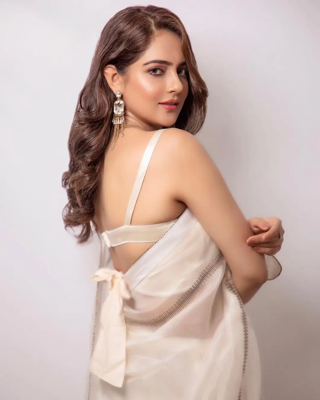 Malvi Malhotra Stills in White Saree Sleeveless Blouse